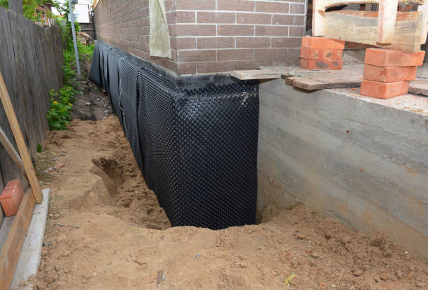 Happy homeowners after waterproofing job in Gurley